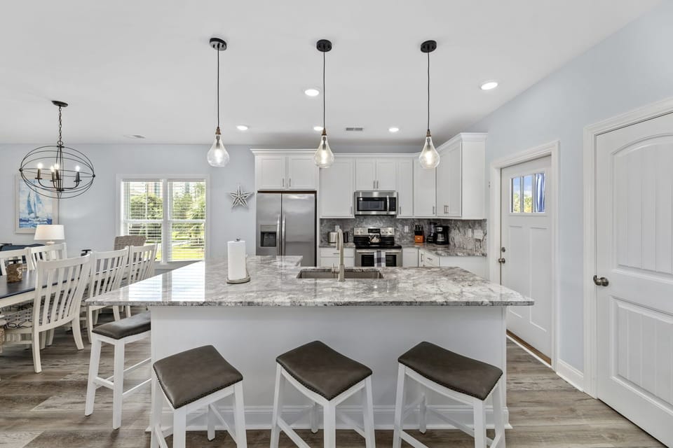 Open and airy kitchen with granite island!!