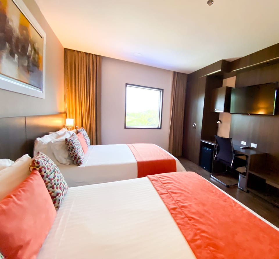 Premium Twin | Premium bedding, down comforters, pillowtop beds, in-room safe