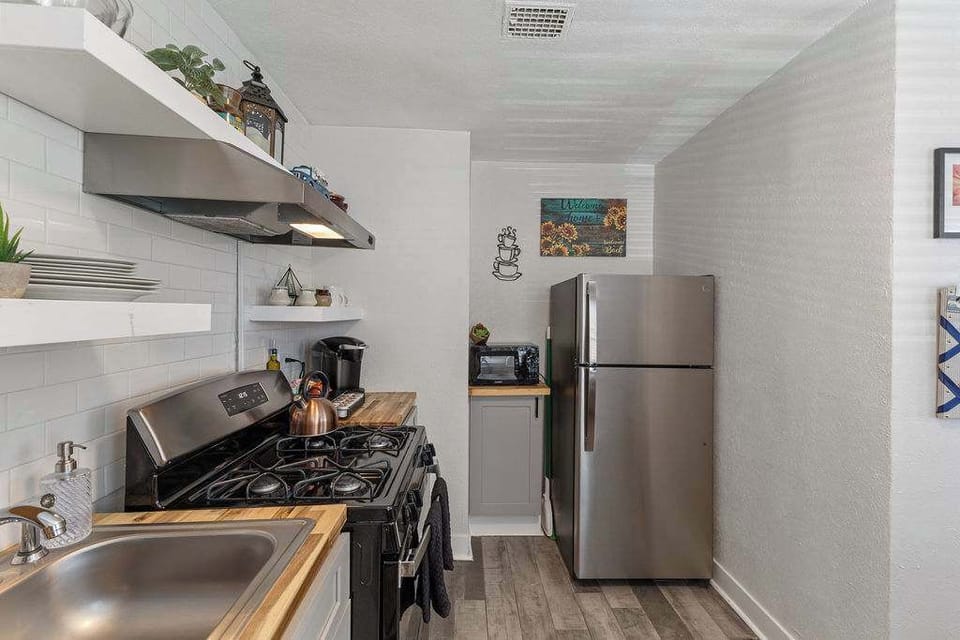 The kitchen also has a microwave and refrigerator.