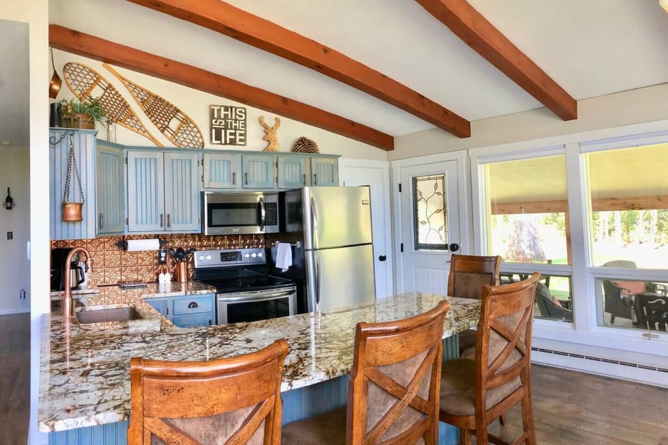 Updated Kitchen with beautiful hammered copper sink and heirloom English copper decor. Newly upgraded Flex-brew coffee maker brews ground coffee by the pot as well as individual k-cup pods. 