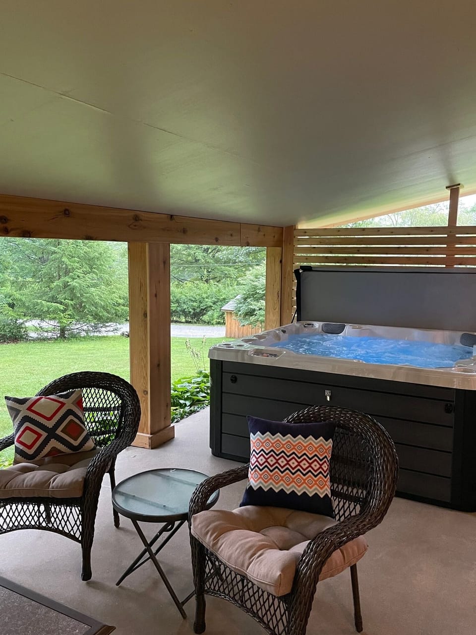 Large covered porch with therapeutic hot tub