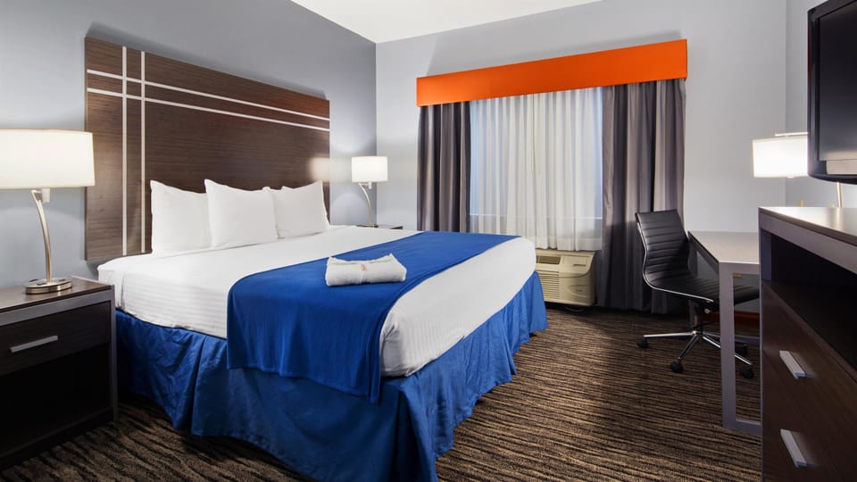 Desk, blackout drapes, iron/ironing board, free cribs/infant beds