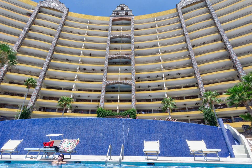 Pools cascade between the Sky tower and the beach