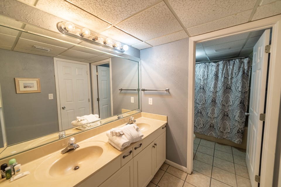 Your en-suite main bath is part of the main suite and features a large soaking tub and double vanities