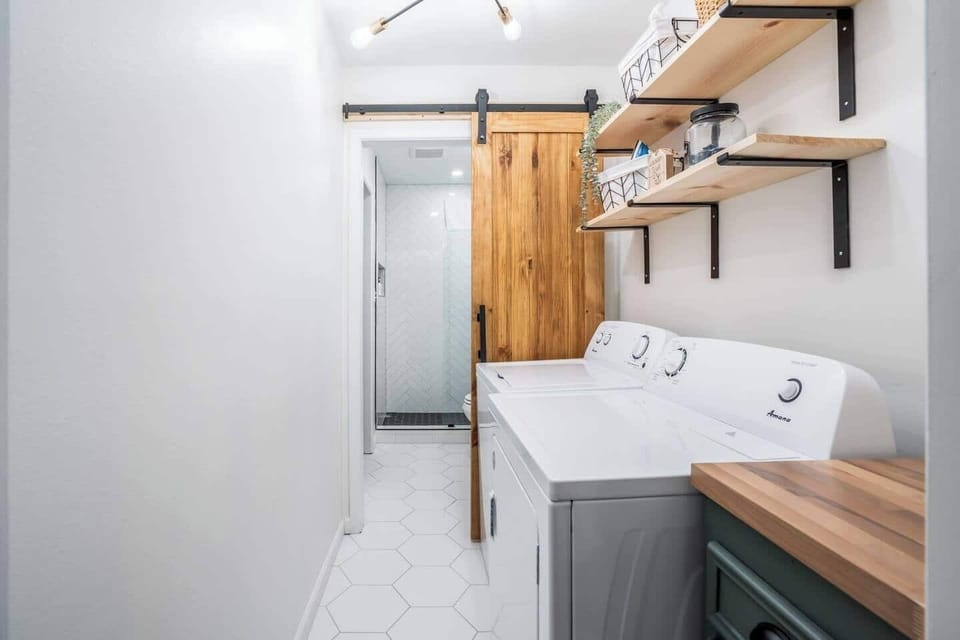 Wash your clothes with convenience in this laundry room conveniently located just between the master bathroom and kitchen/dining. 