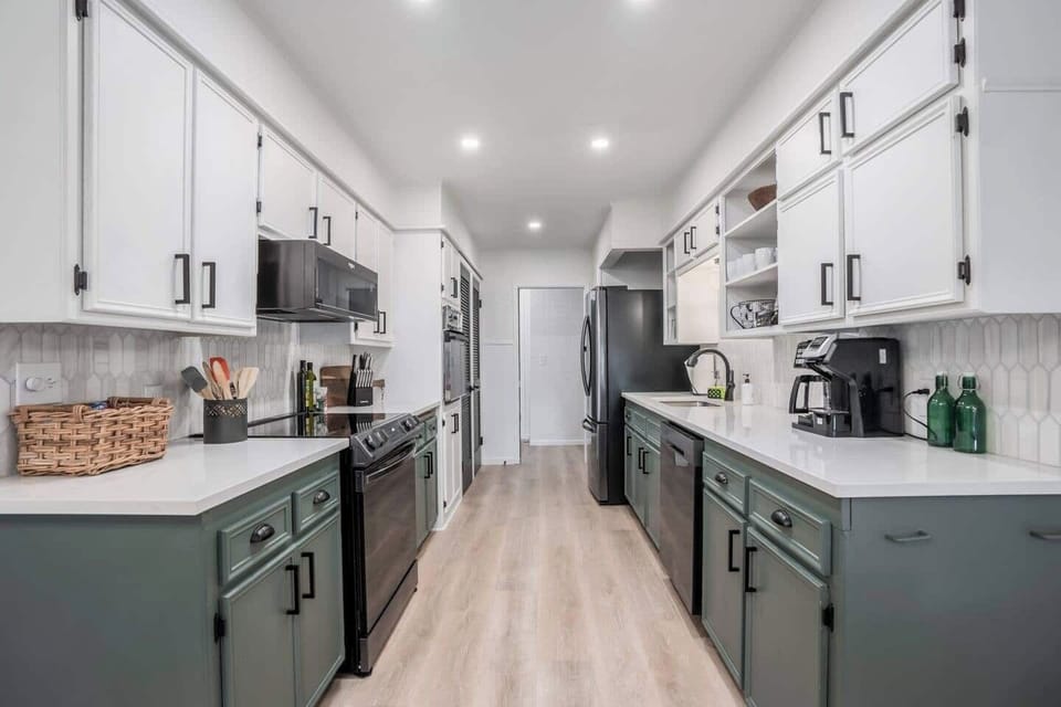 Remodeled kitchen with brand new black stainless steal appliance, Quartz countertops, marble backsplash.  Enjoy using the small appliances that we offer  (including a toaster, Dual Coffee Maker, Blender, Hand Mixer). 