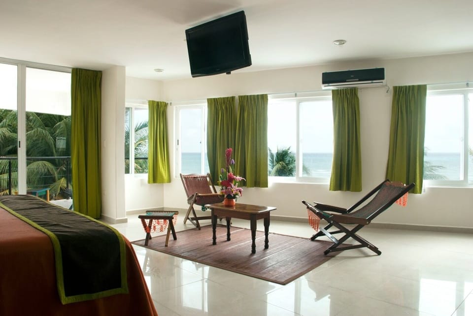 Junior Room | Living area | 32-inch flat-screen TV with cable channels, books