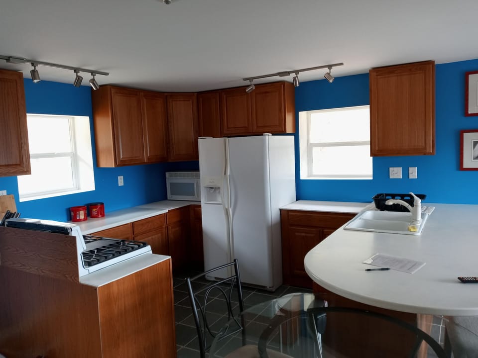 Very spacious, well lit, workable kitchen.