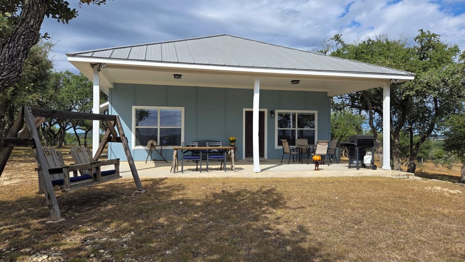 Cowhouse front porch and swing, 12 ft x 30 ft covered porch