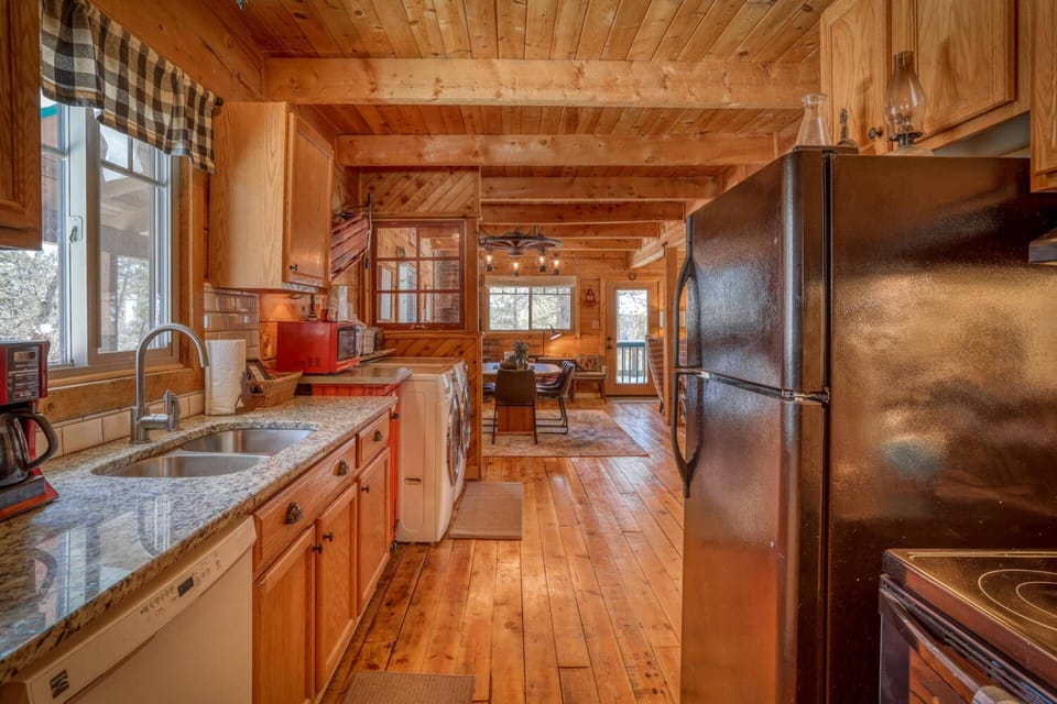 Full Kitchen with Fridge, Stove/ Oven, Coffee Makers, and Double Sink