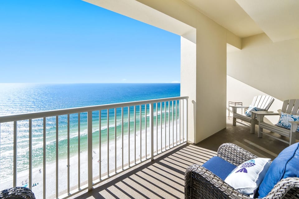 Sink into plush seating on your private balcony and watch endless ocean waves roll onto pristine sands below.