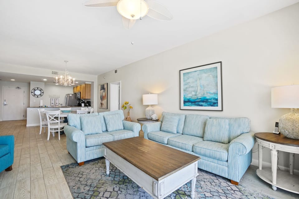 Relax in your coastal-inspired living space with comfortable seating and ocean-themed decor that creates the perfect beach getaway atmosphere.