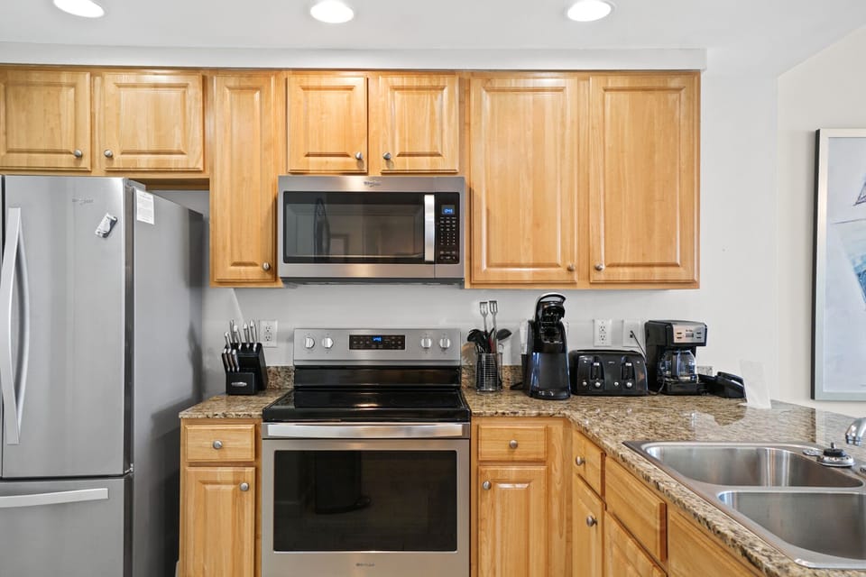 Your fully equipped kitchen awaits with stainless steel appliances, granite counters, and everything you need to create delicious meals during your stay.