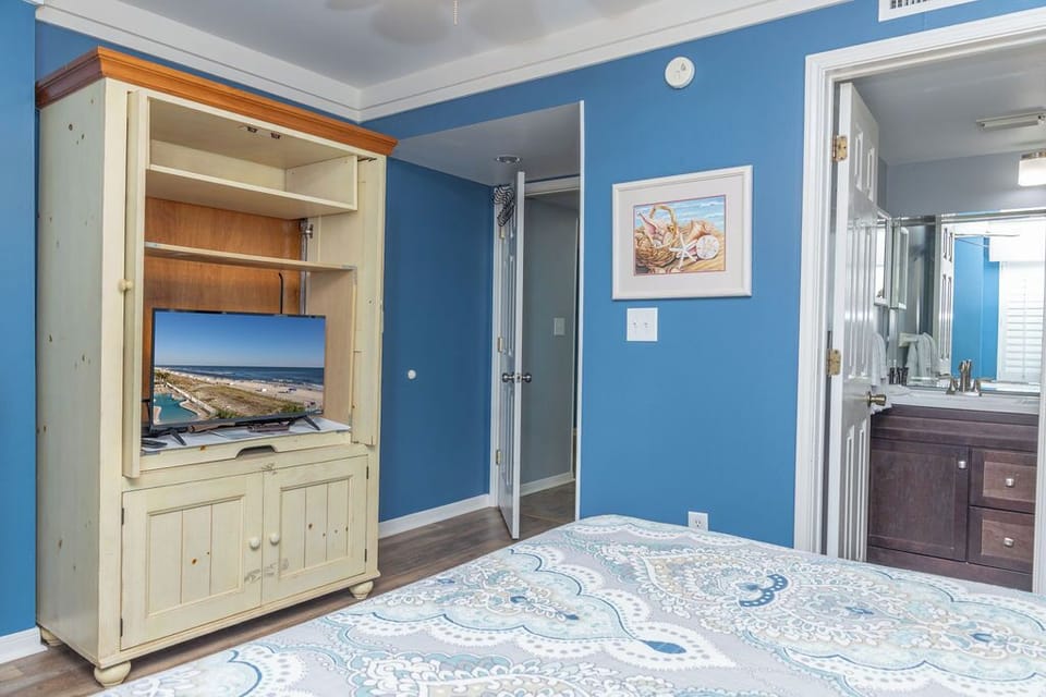 Bedroom 2 - Relax and unwind to your own space after a long day on the beach in this spacious guest bedroom which features a television and private bathroom.