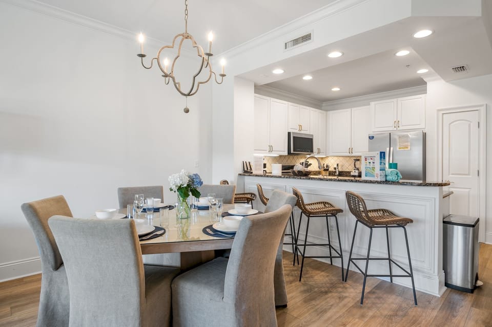 Dining area with barstools (4) for extra seating - Each of Your Friend at the Beach's luxury condos includes a high chair for your little one!