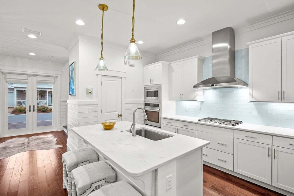 White kitchen with marble countertops
