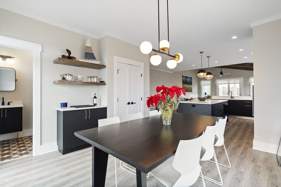 Dining room with seating for 8, bar area and powder room.