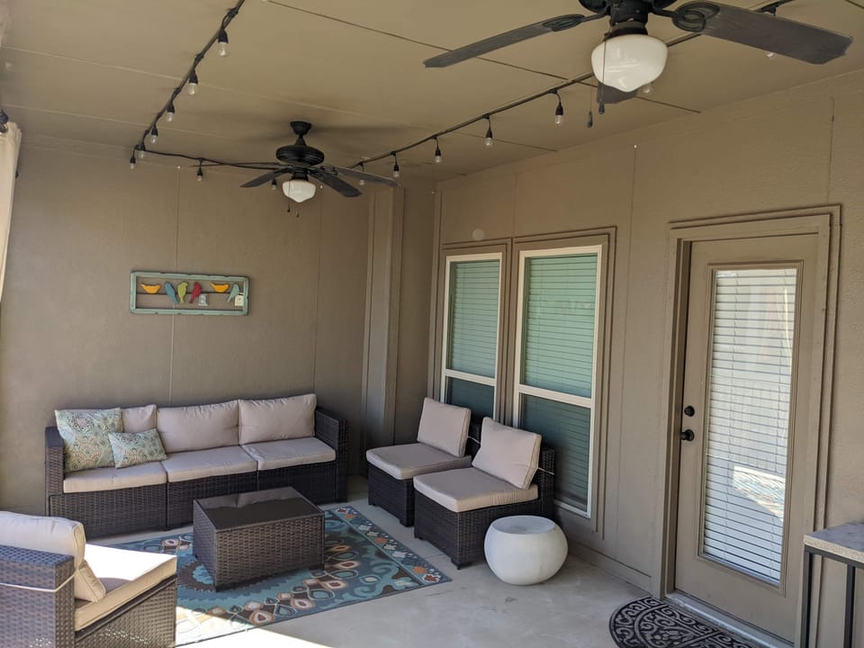 Oversized balcony/patio, bistro set and outdoor lighting/fans