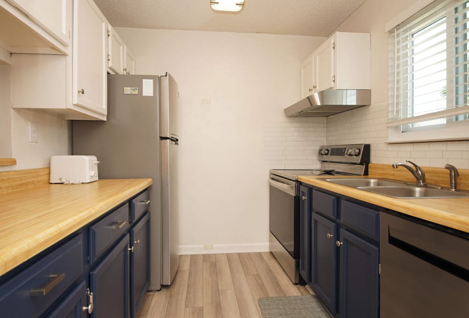 Your fully equipped galley kitchen features warm wood countertops, stainless appliances, and everything you need to prepare home-cooked meals during your stay.