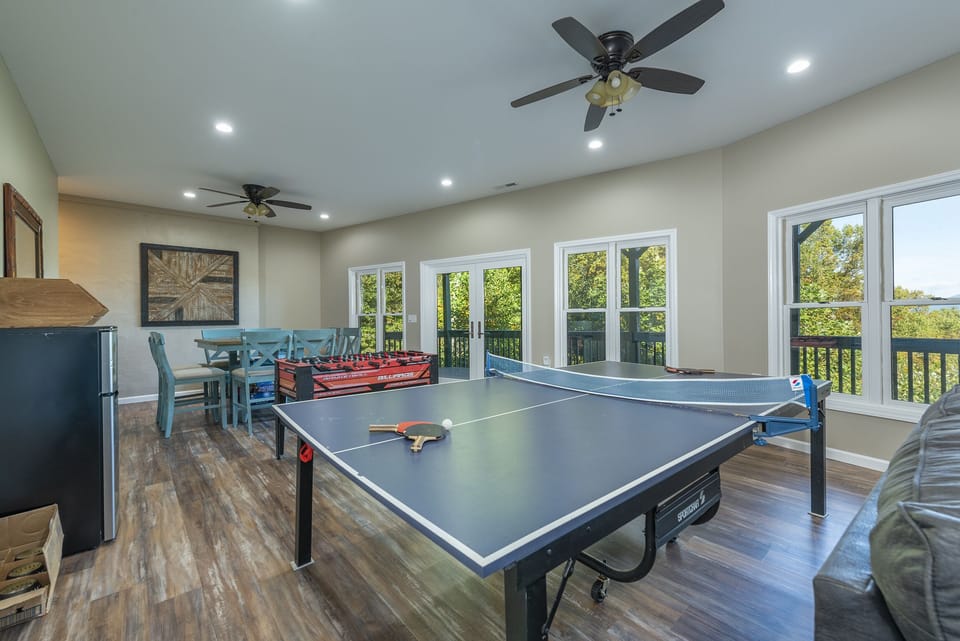 Lower-level game room and sitting area (streaming-only TV).