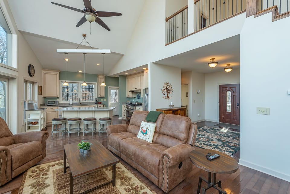 The main entrance leads to the open kitchen, living, and dining areas.