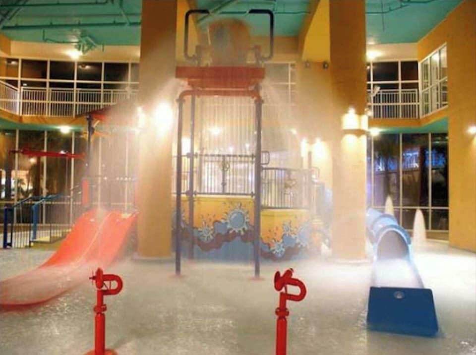 Wonderful fun with kid's water park area featuring slides, spray toys and water bucket!