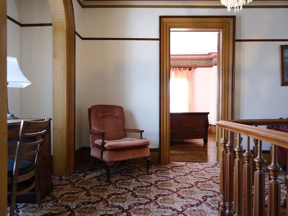 More of the Hallway with a Writer's Desk to the Left facing out.