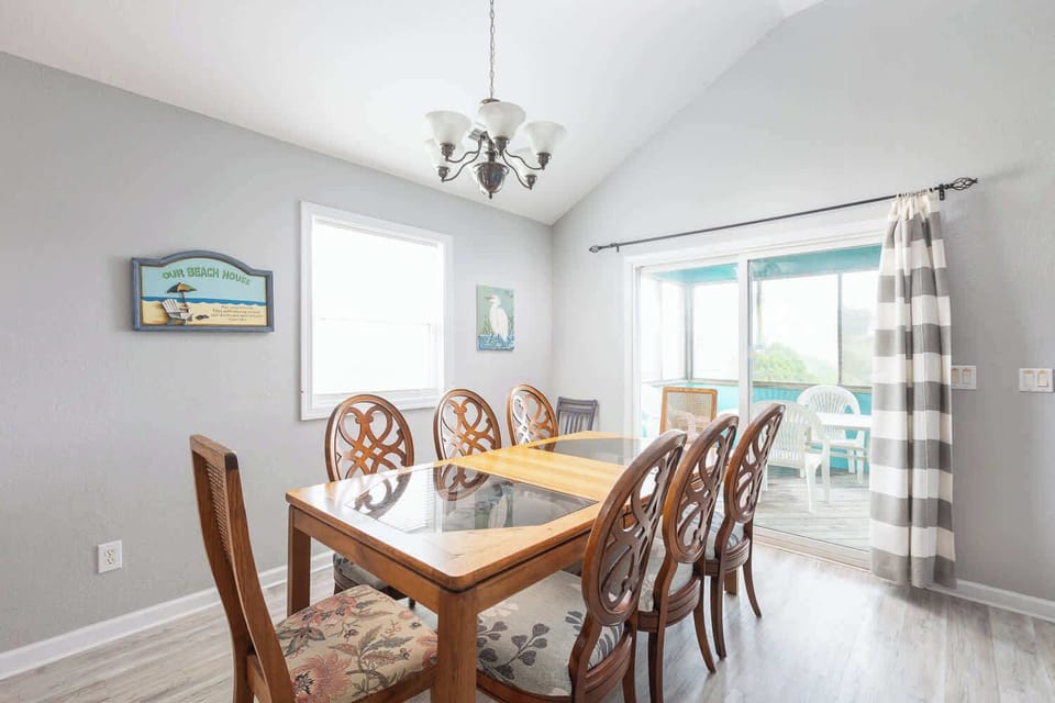 Top Level: Dining area with table seating for eight (8).