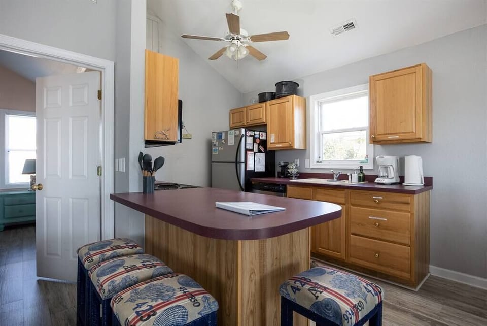 Well-Stocked Kitchen with Breakfast Bar Seating
