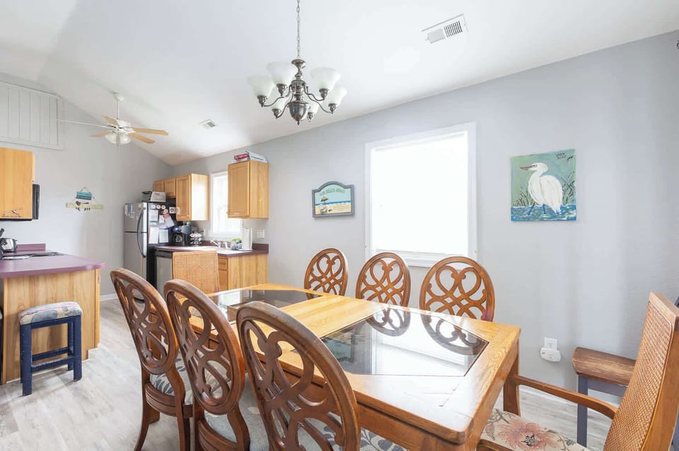 Top Level: Dining area with table seating for eight (8).