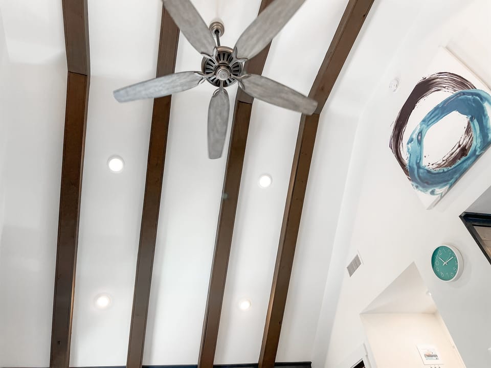 Vaulted ceilings and lots of windows create an airy "above the trees" vibe!