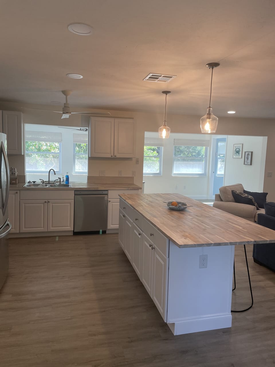 Kitchen leads to dining area and outdoor patio.