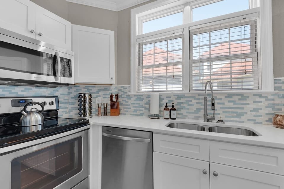 Kitchen area with sink and cooking basics