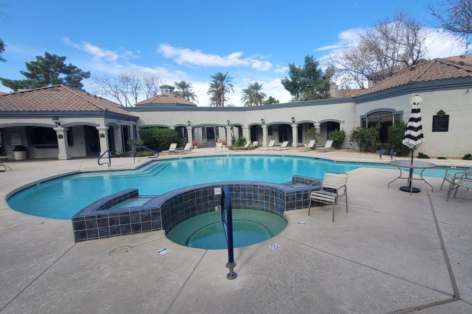 Main Pool & Hot Tub with plenty of lounge chairs & BBQ grill