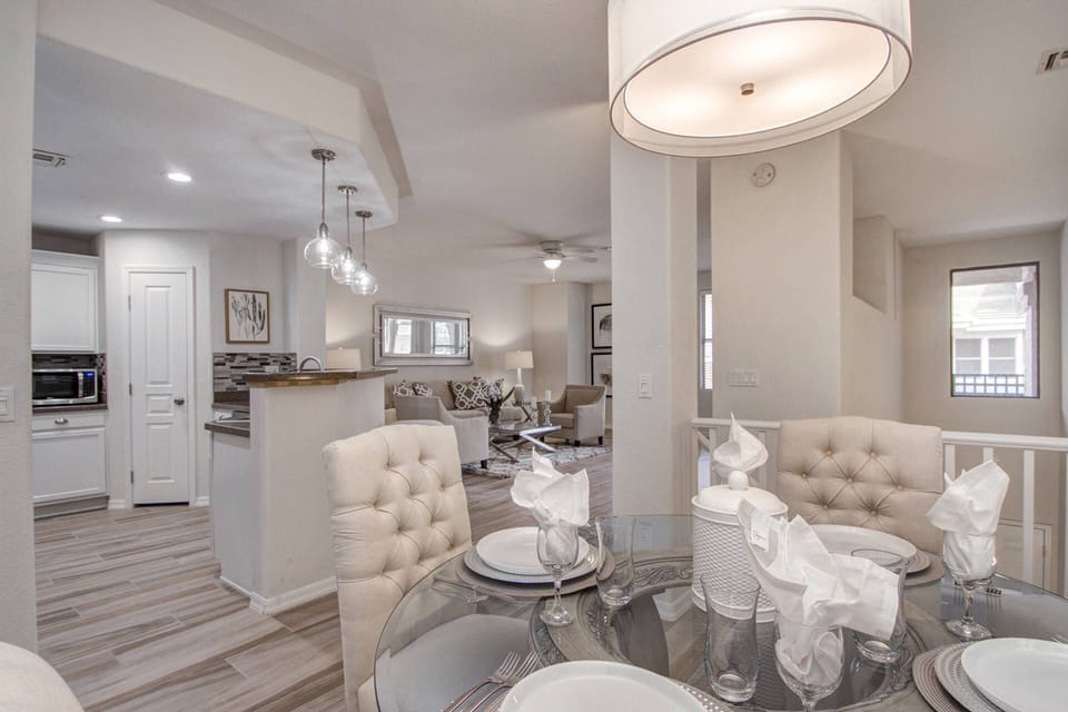 View from the dining room table to the kitchen and main room