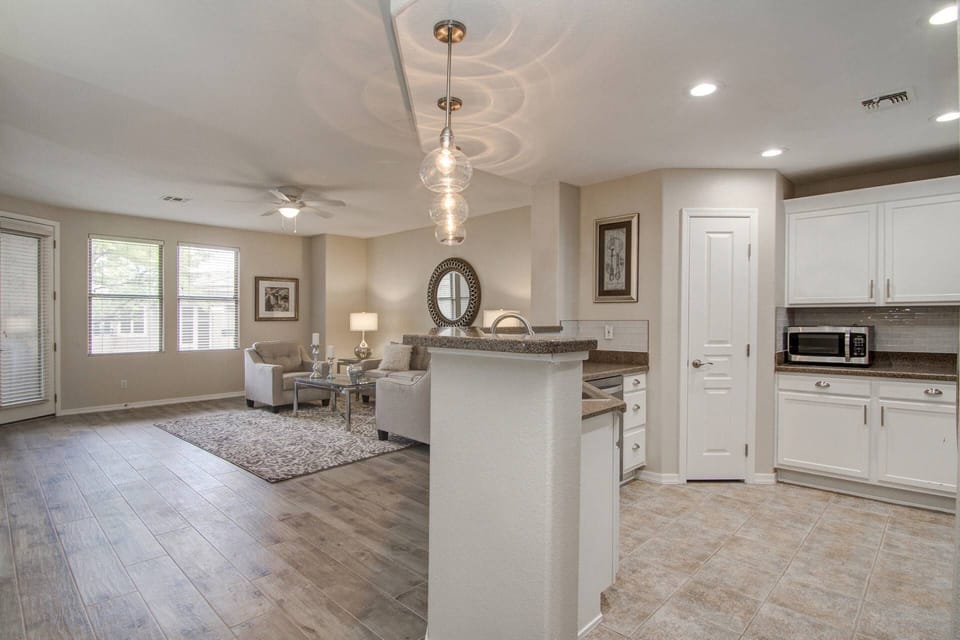 View from hallway into the kitchen and gathering room