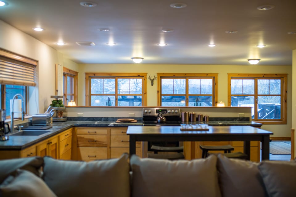 View from living area toward kitchen and sun room