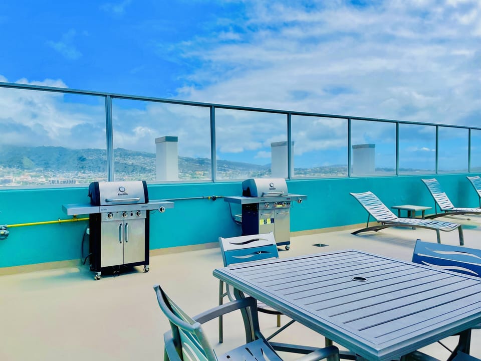 BBQ grills and picnic area on rooftop 