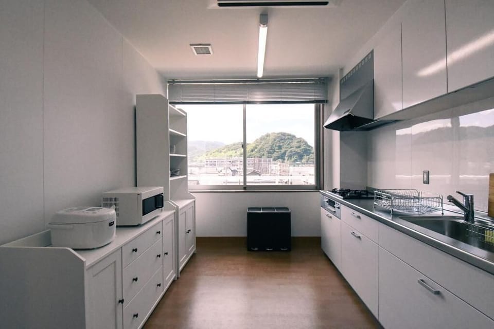 Full-size fridge, microwave, stovetop, toaster