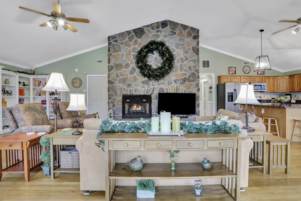 Cozy fireplace next to a 65" 4K UHD TV in the Great Room.