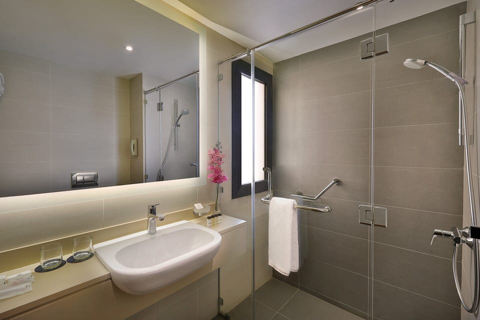 Combined shower/tub, designer toiletries, hair dryer, bathrobes