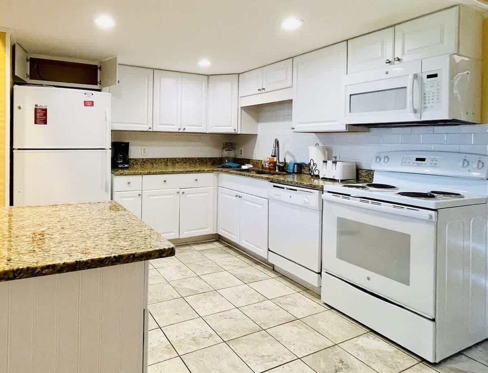 Fully stocked kitchen with everything you need for home-cooked meals by the beach.

