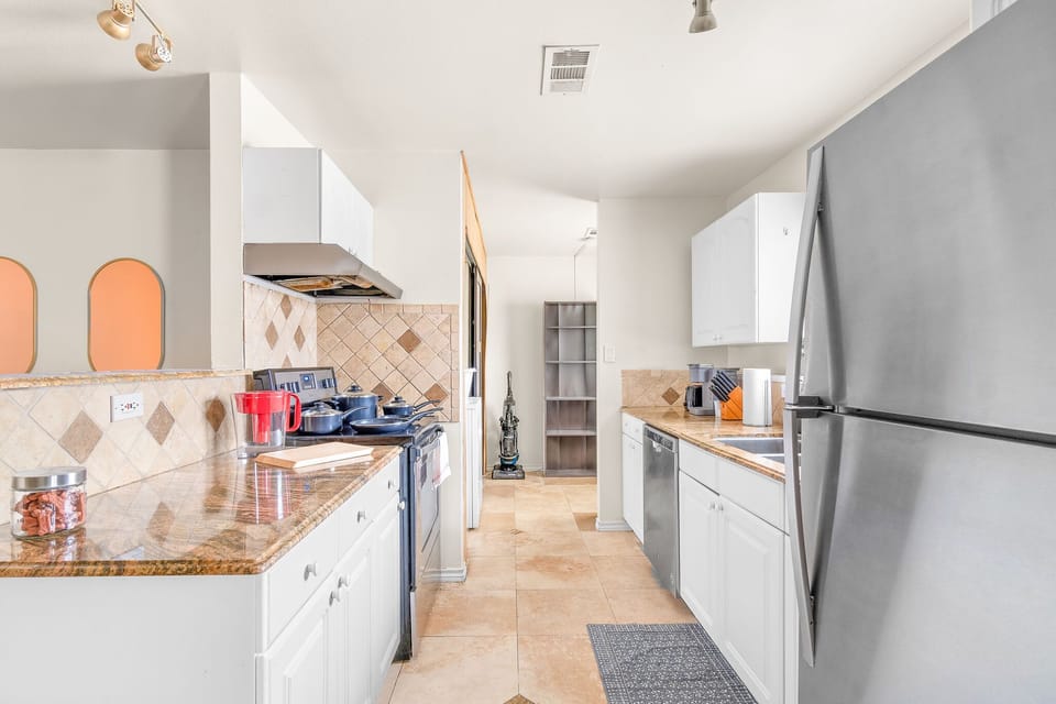 Kitchen with cooking essentials and stainless steel appliances