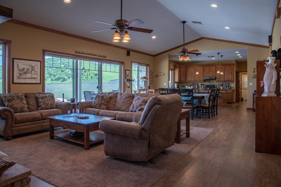 Living Area - The great room (living room, dining and large kitchen) boasting forever views.