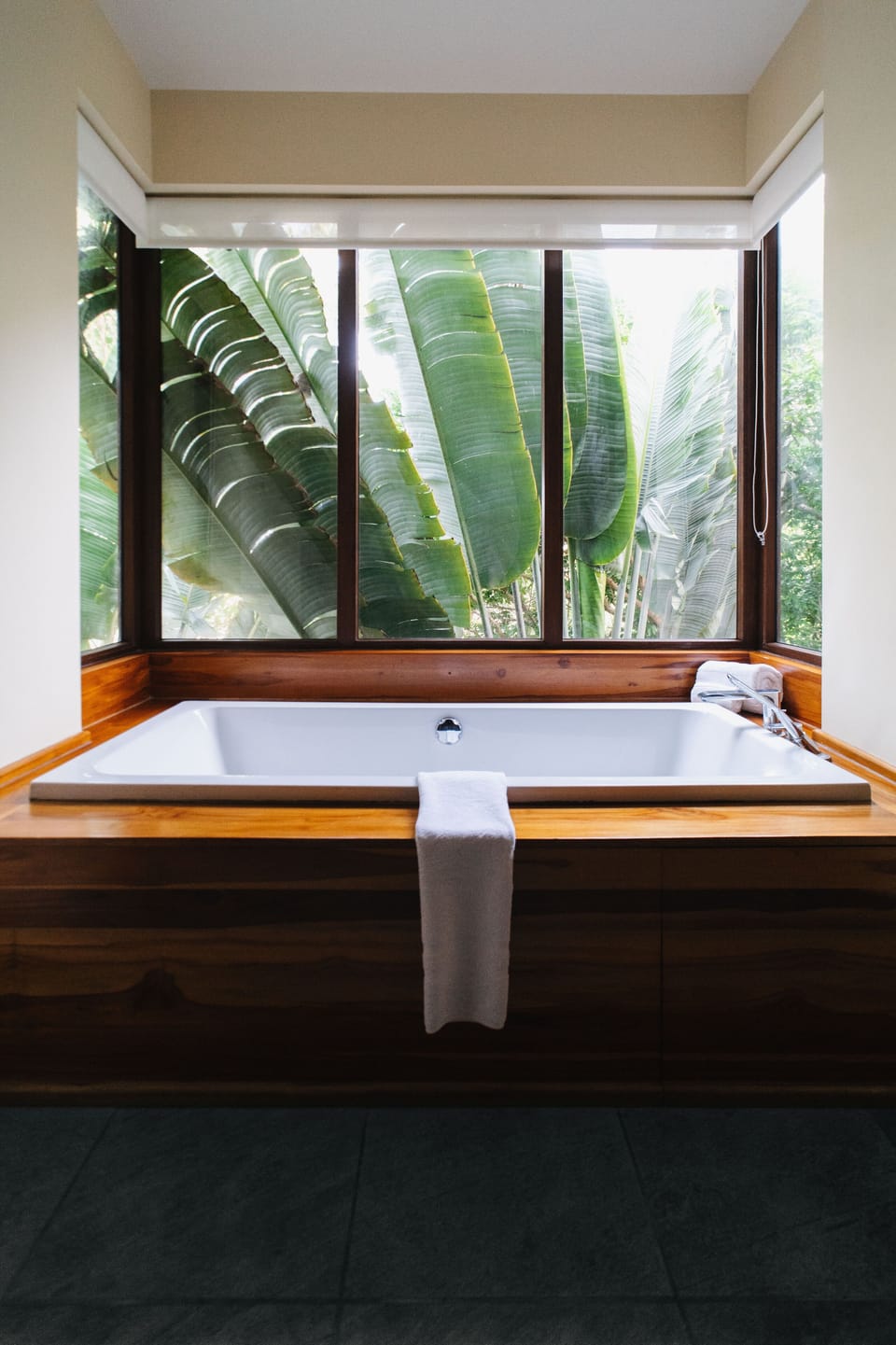 Separate tub and shower, deep soaking tub, slippers, towels
