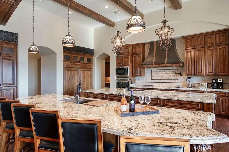 Chef's kitchen with Wolf appliances and top-end finishes for gourmet meals
