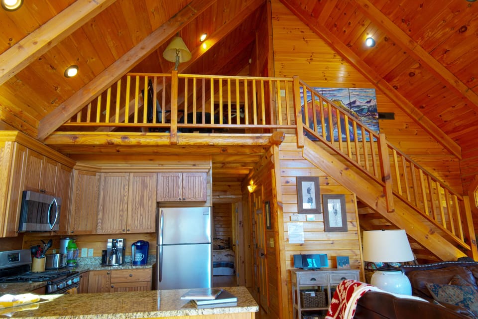 The upstairs landing overlooks the common living space.