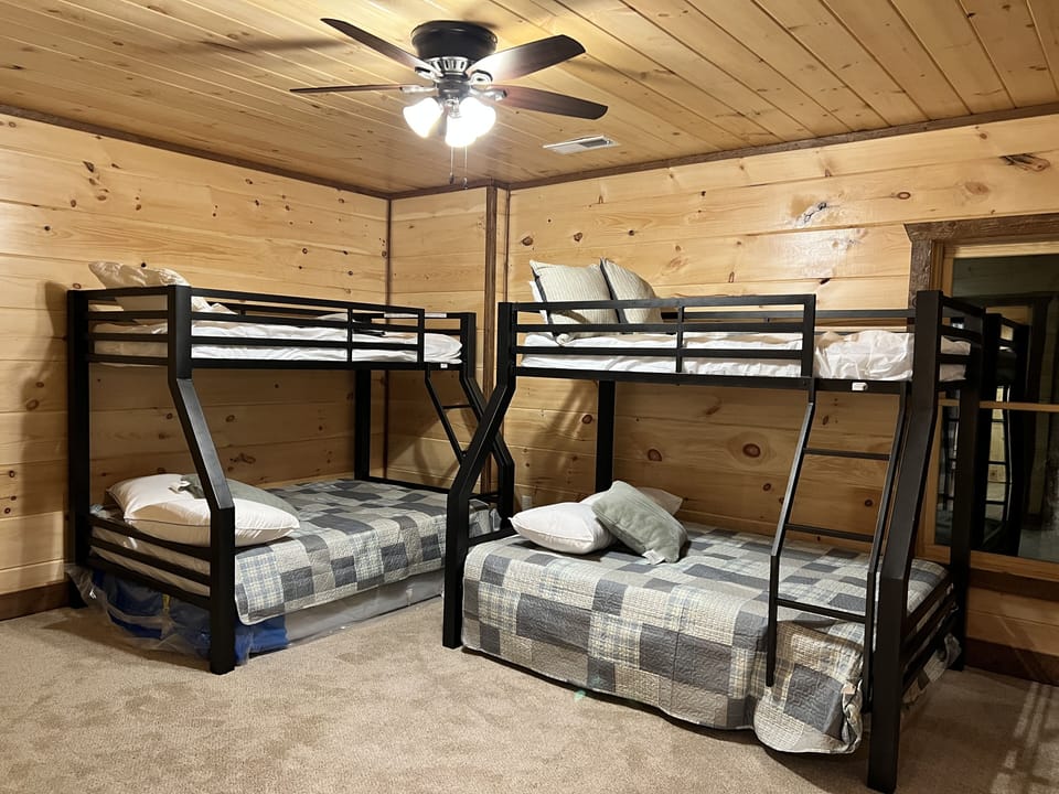 Bedrm 4: bunk-beds x2, twin (top)/ full (bottom) beds. Door leads out to deck.