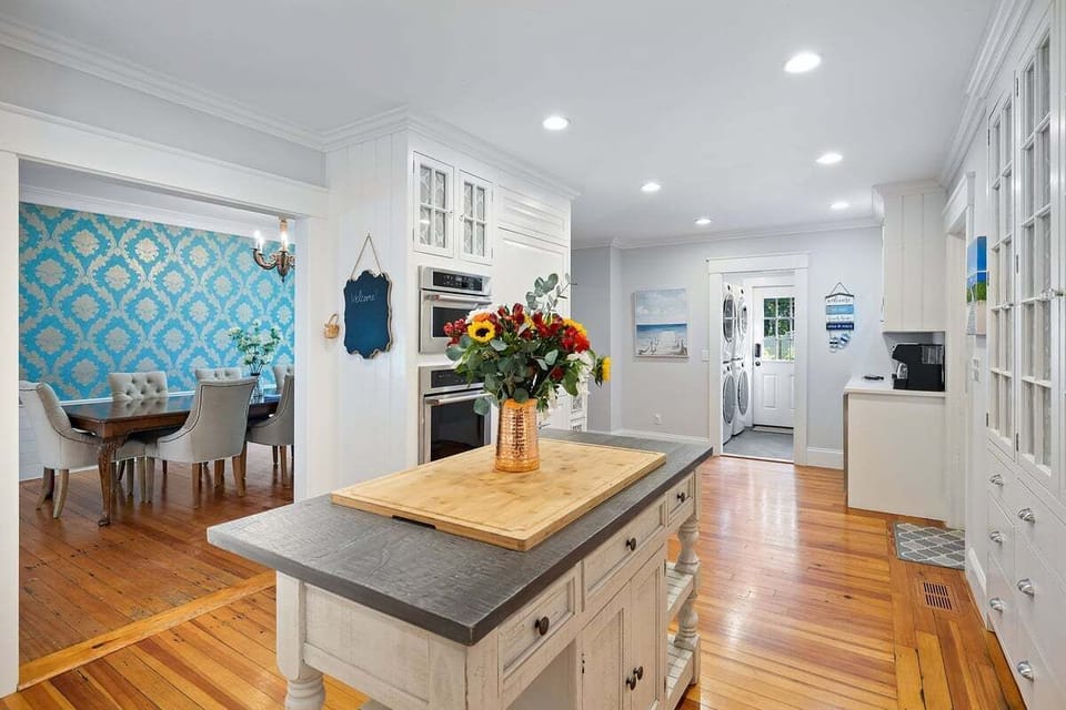 Large kitchen located in the back of the house off the garage and close to the pool area.