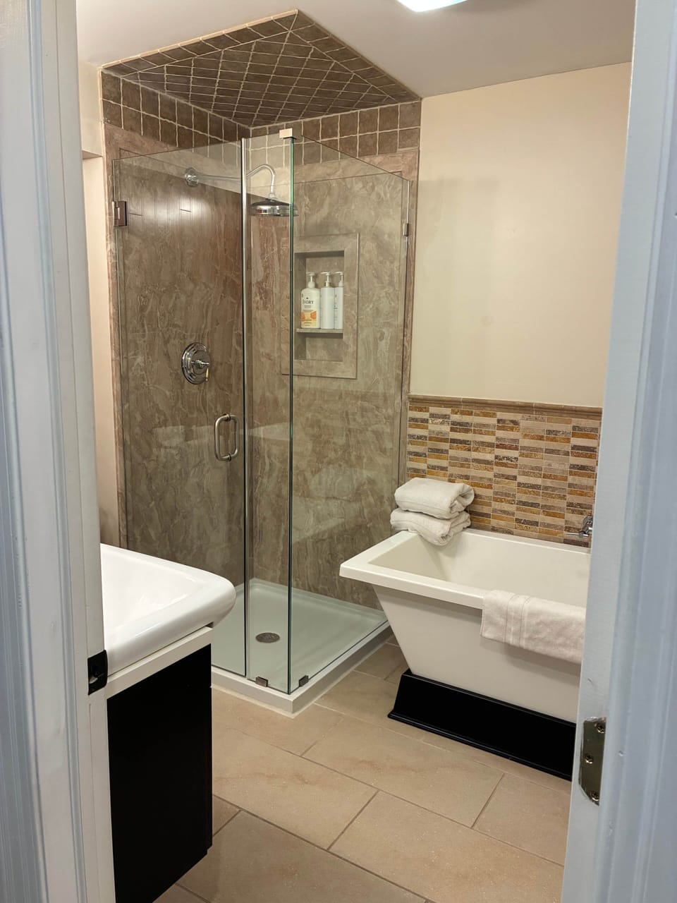 Bathroom with tub and shower